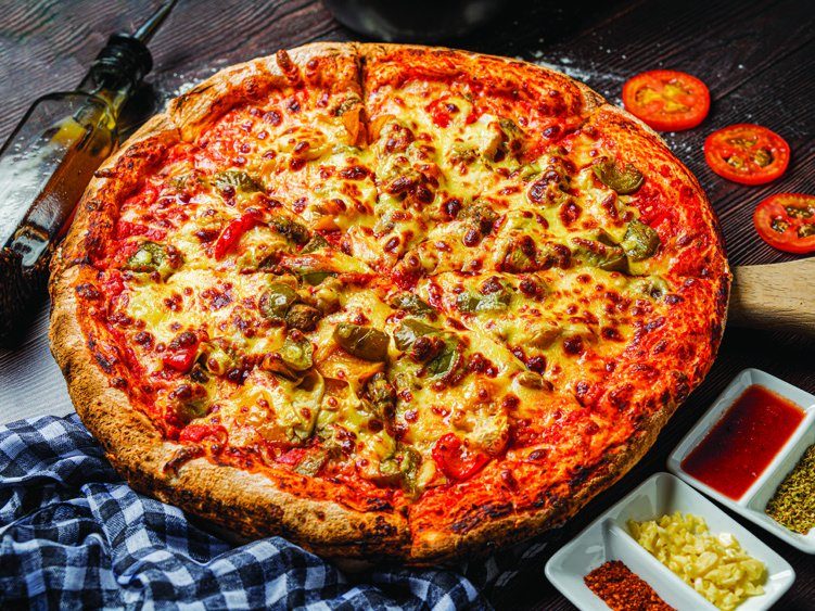 Meat feast pizza with condiments