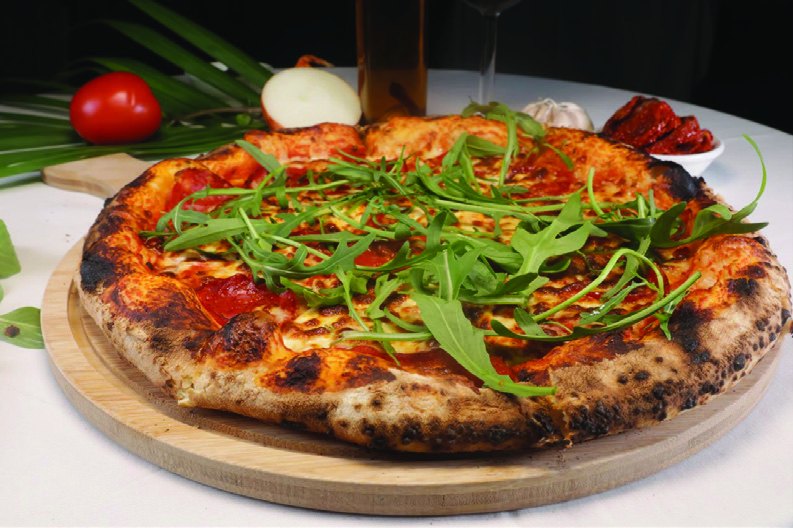 Pizza topped with fresh rocket