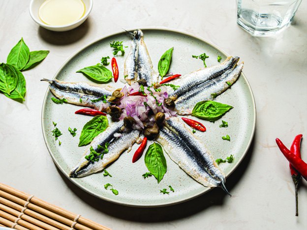 Fresh anchovies plate with olive oil