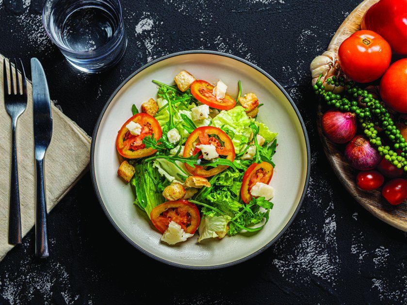 Caprese and garden salad on the table